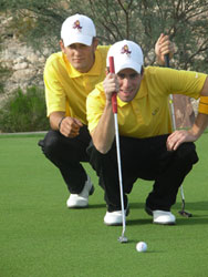 ASU golfers Brian Roser and Douglas Swiner sizing up a putt